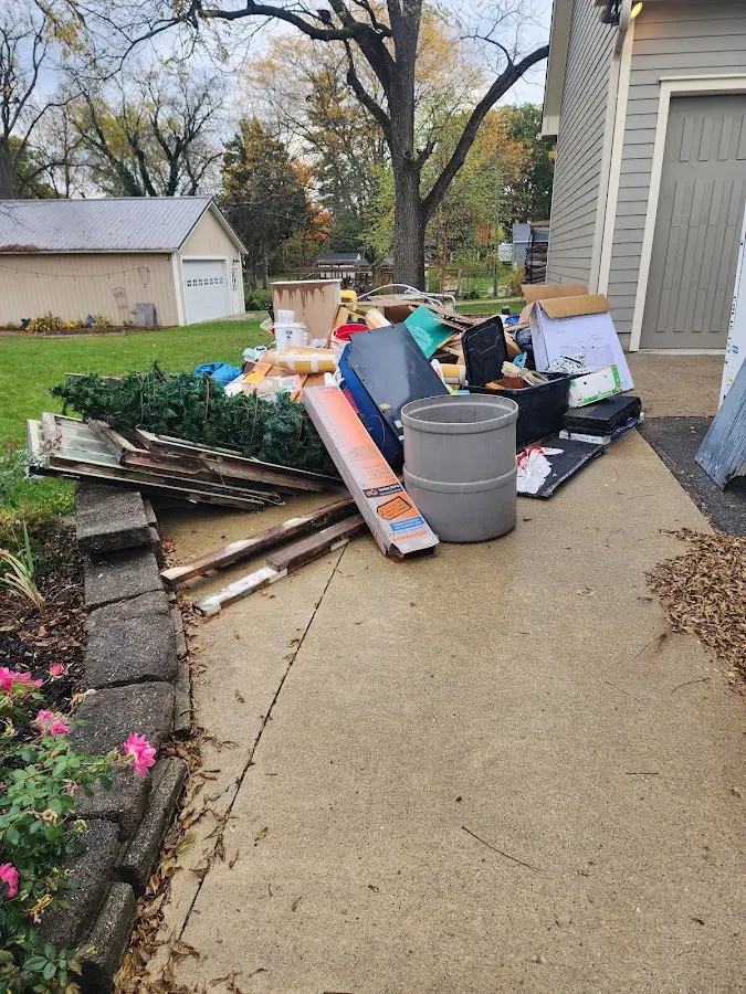 Dumpster being loaded with debris for 30 Yard Dumpster Rental in Belvedere Park